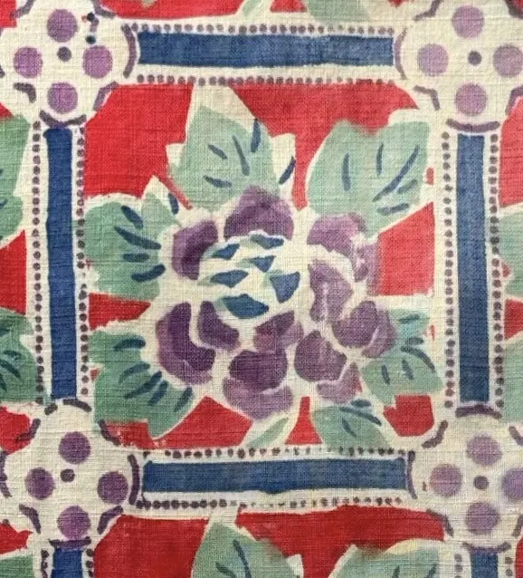 Purple peony centred inside a blue and red framed repeat.